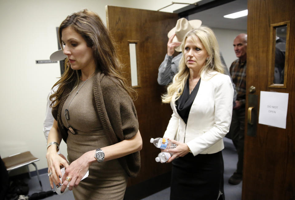 STEPHENVILLE, TX - FEBRUARY 11: Taya Kyle, wife of slain Navy SEAL Chris Kyle, leaves the courtroom after the capital murder trial of former Marine Cpl. Eddie Ray Routh at the Erath County Donald R. Jones Justice Center February 11, 2015 in Stephenville, Texas. February 11, 2015 in Stephenville, Texas. Eddie Ray Routh, 27, of Lancaster, Texas is charged with the 2013 deaths of former Navy SEAL Chris Kyle and his friend Chad Littlefield at a shooting range near Glen Rose, Texas. (Photo by Tom Fox - Pool/Getty Images)