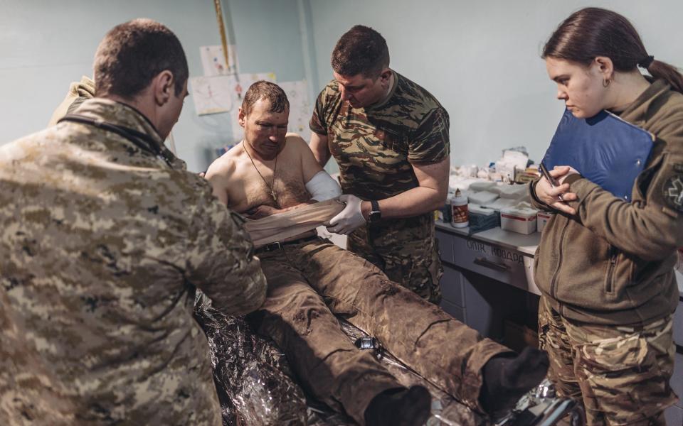 Ukrainian army medics treat a wounded man in a field hospital near Bakhmut - Anadolu Agency/Anadolu