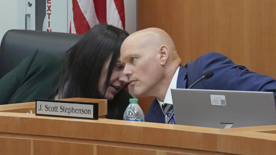 Utah Board of Pardons board chair Scott Stephenson and vice chair Melissa G. Stirba talk during the Utah Board of Pardons commutation hearing for death row inmate Taberon Honie Monday, July 22, 2024, at the Utah State Correctional Facility, in Salt Lake City. (AP Photo/Rick Bowmer)