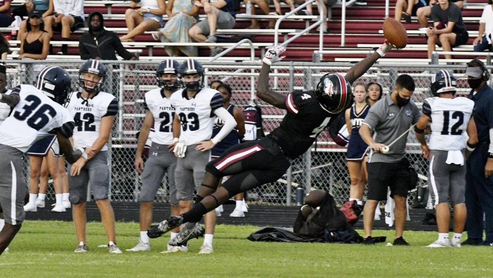 Palm Beach Central receiver Luby Maurice Jr. extends for a difficult ball during the first half of Friday night's game against Dwyer. He later caught a touchdown to help extend the insurmountable Broncos lead in a win over Dwyer on Sept. 3, 2021.