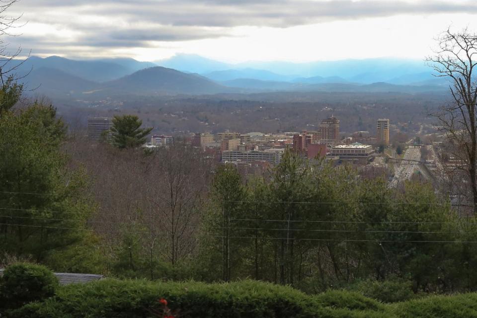 This photo taken March 18, 2014 shows downtown Asheville, N.C. The 2012 election should have been a good one for Democrats running for Congress in North Carolina. Together, they received a total of 2.2 million votes _ nearly 100,000 more than their Republican opponents. But when the votes were divvied up among the state’s 13 House districts, the Democrats came up short. Way short. Republicans won nine seats and Democrats won only four. How did Republicans pull off this unlikely feat? State lawmakers set the stage when they redrew the boundaries of congressional districts following the 2010 Census. (AP Photo/Adam Jennings)