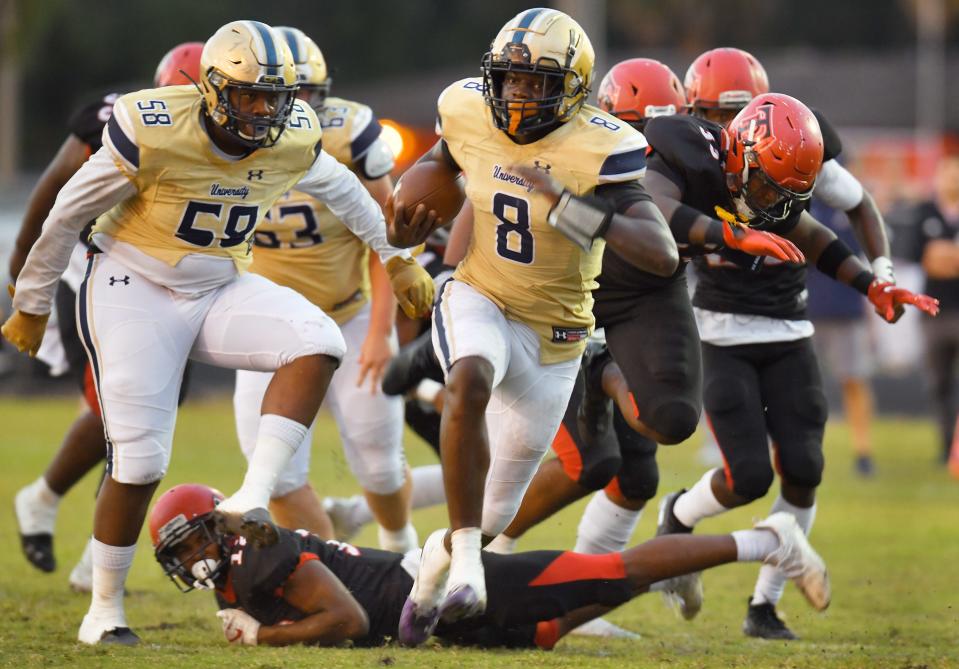 University Christian quarterback (8) Desirrio Riles runs through Terry Parker defenders on his way to a late first-quarter touchdown. The Terry Parker football team hosted University Christian at Joe Hodge Field Friday, October 22, 2021.