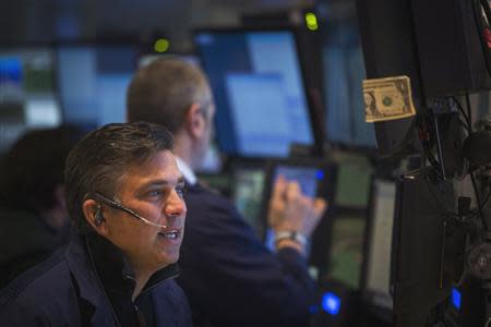 A trader works on the floor of the New York Stock Exchange shortly after the opening bell in New York April 4, 2014. REUTERS/Lucas Jackson