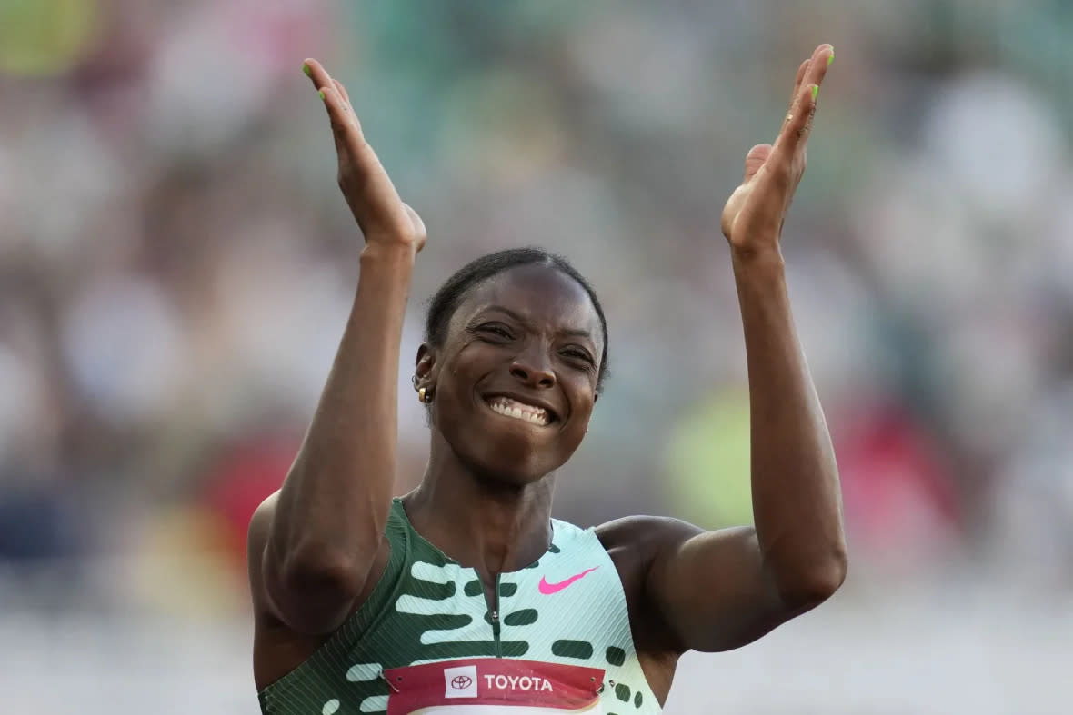 Nia Ali reacts as she crosses the finish line to win the women’s 100 meter hurdles final during the U.S. track and field championships in Eugene, Ore., Saturday, July 8, 2023. (AP Photo/Ashley Landis)