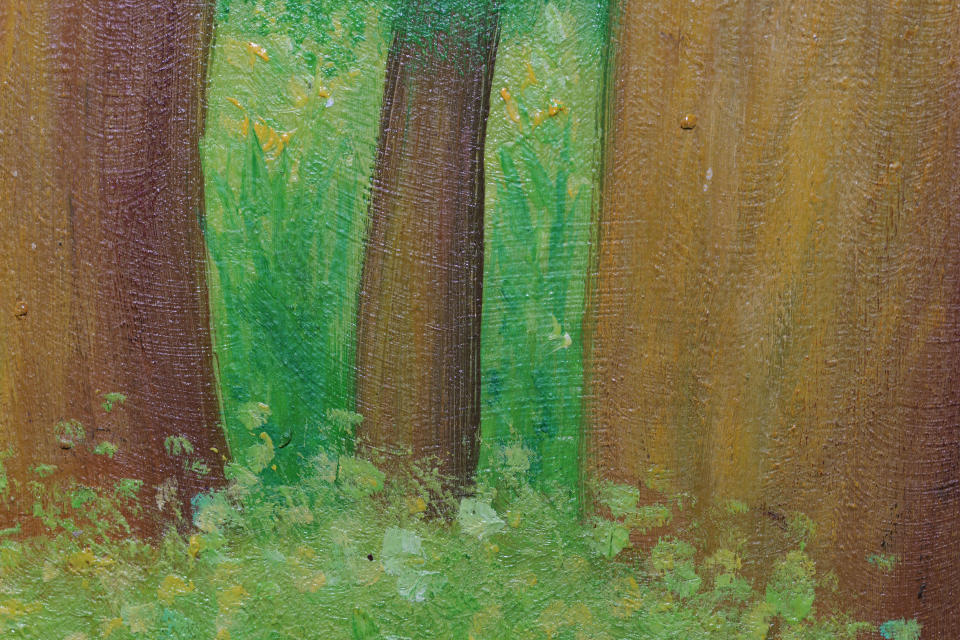 Close up of an oil painting of trees