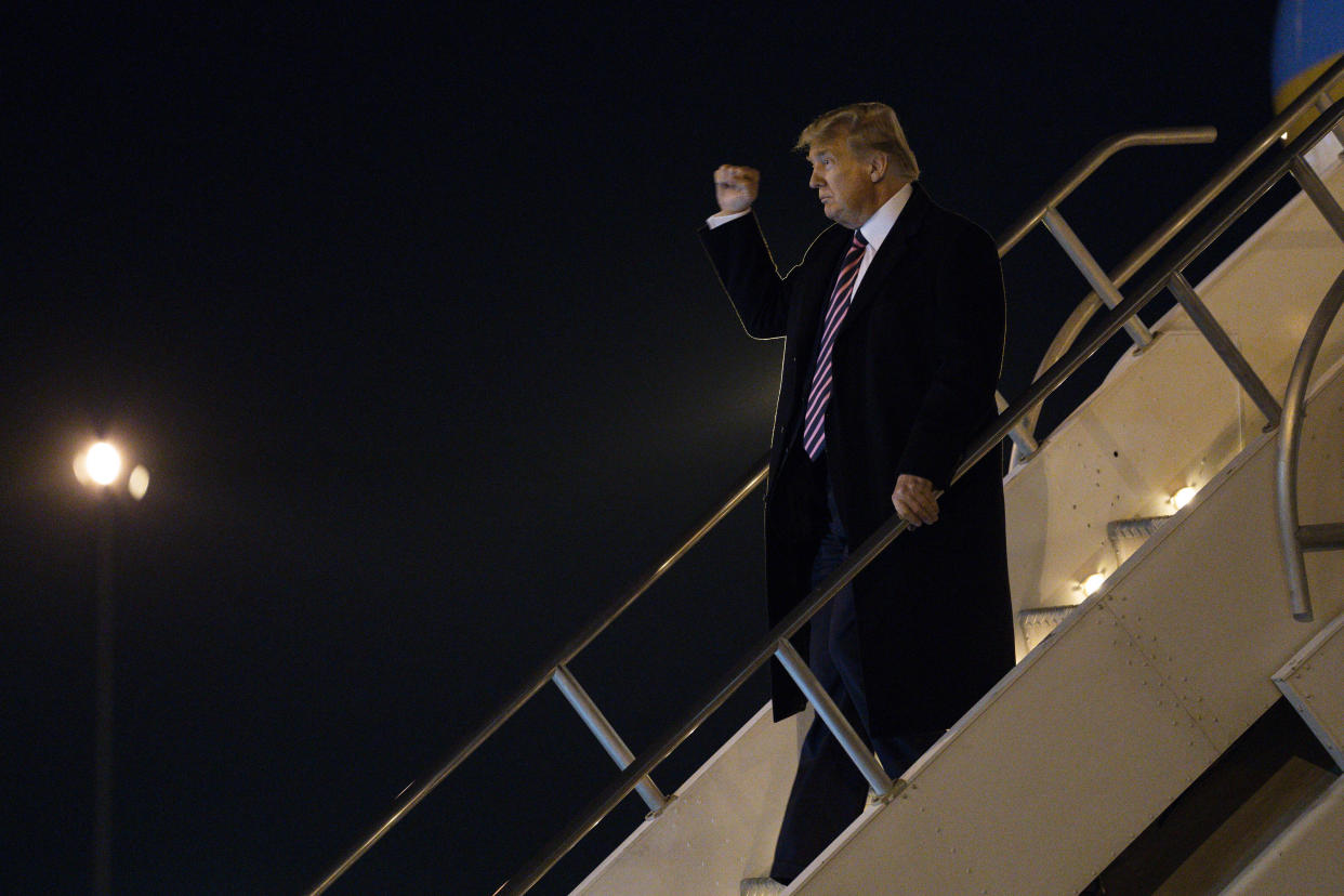 President Donald Trump pumps his fist as he arrives at McCarran International Airport on Feb. 18 in Las Vegas. (Photo: ASSOCIATED PRESS)