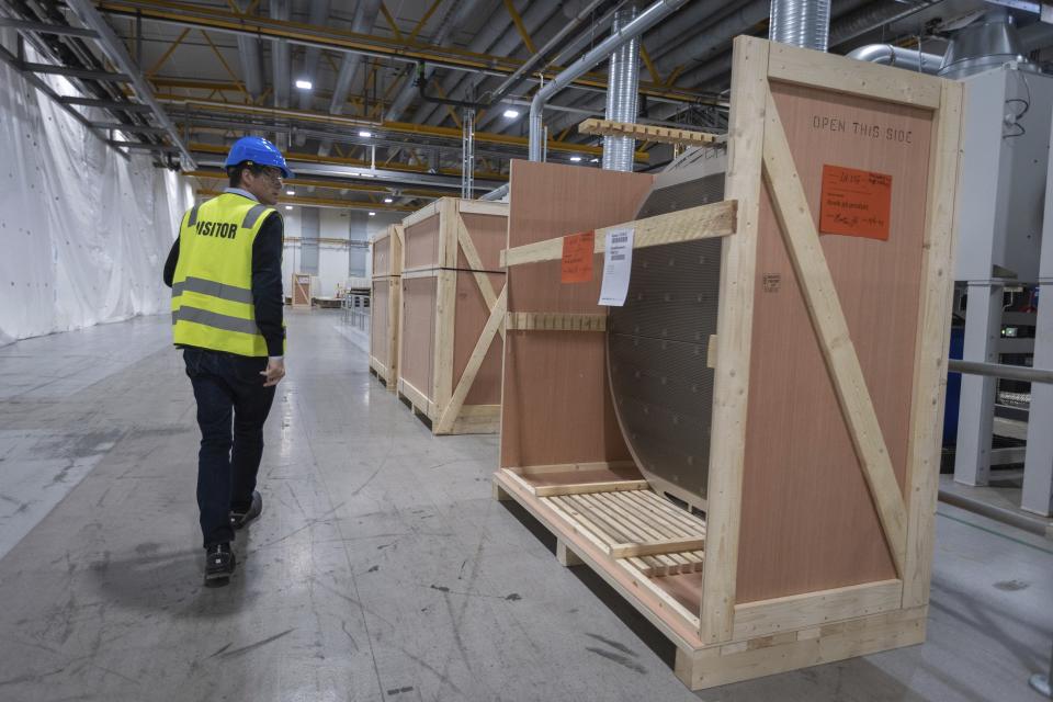 Lars Nermoen, head of communications, walks through facility for the Norwegian company Nel in Heroya, Norway, on April 20, 2023. Nel makes devices that take water and split it into hydrogen and oxygen, known as electrolyzers, as well as fueling stations. The company announced plans Wednesday, May 3, to build a massive new plant in Michigan as it works with General Motors to drive down the cost of hydrogen. (AP Photo/Trond R. Teigen)