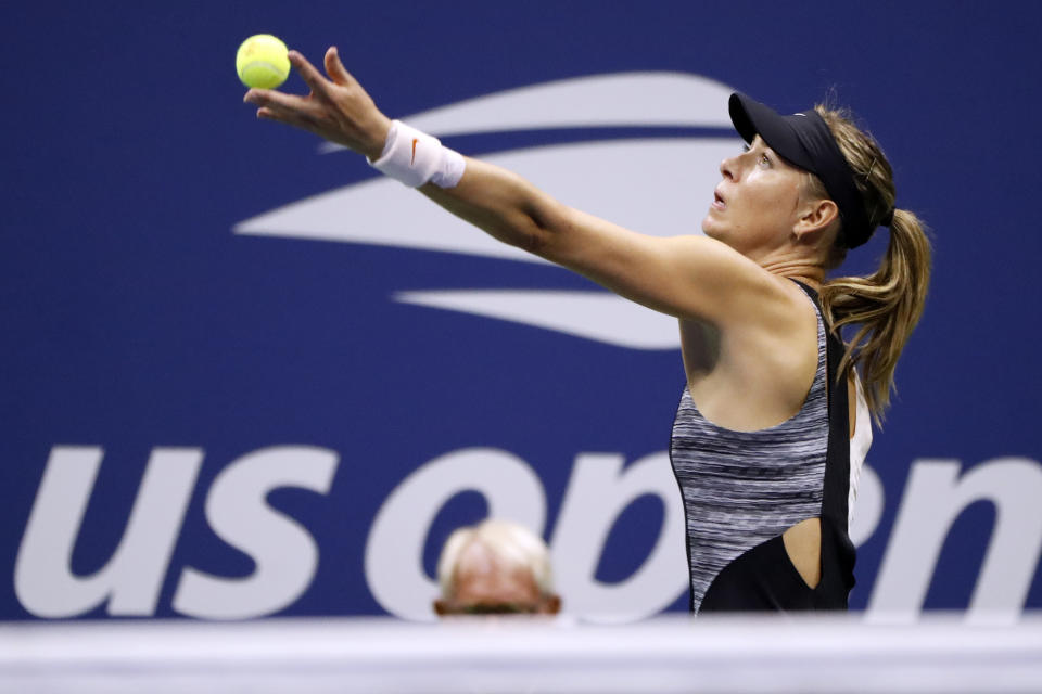 Maria Sharapova, of Russia, serves to Jelena Ostapenko, of Latvia, during the third round of the U.S. Open tennis tournament, Saturday, Sept. 1, 2018, in New York. (AP Photo/Adam Hunger)