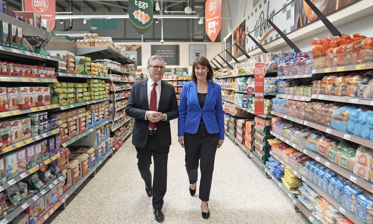 <span>Labour’s Rachel Reeves and Keir Starmer visit a branch of Morrisons in Wiltshire during their general election campaign trail.</span><span>Photograph: Stefan Rousseau/PA</span>