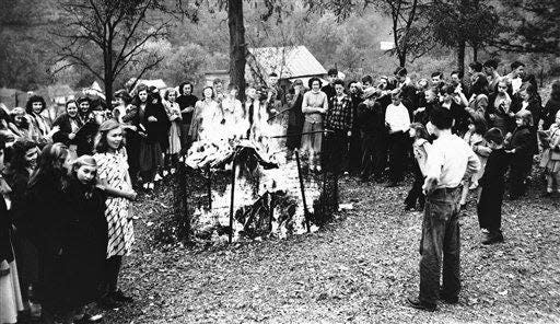 Thirteen-year-old David Mace officiated as Spencer grade school children burned 2,000 comic books they have been collecting for weeks in Spencer, W.Va., on Oct. 26, 1948. The campaign was initiated by the parent-teacher association on the ground the books are mentally and morally injurious to boys and girls.