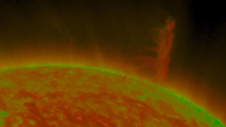 A tornado of fire towers above the sun's surface