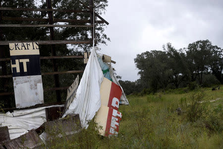 Fragments remain of a billboard after Hurricane Irma in White Springs, Florida U.S. September 11, 2017. REUTERS/Mark Makela