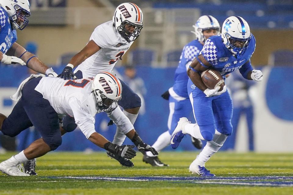 Kentucky running back Travis Tisdale (33) runs with the ball during the second half of an NCAA college football game against UT Martin, Saturday, Nov. 23, 2019, in Lexington, Ky.