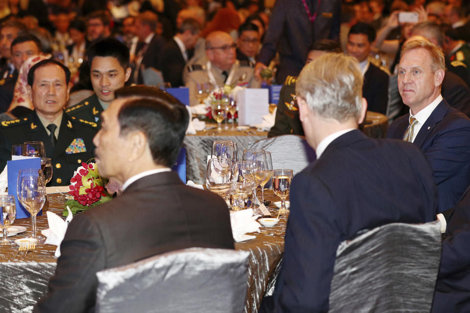 Acting U.S. Secretary of Defense Patrick Shanahan, right, and Chinese Minister of National Defense Wei Fenghe, left, attends the opening dinner of the 18th International Institute for Strategic Studies (IISS) Shangri-la Dialogue, an annual defense and security forum in Asia, in Singapore, Friday, May 31, 2019. (AP Photo/Yong Teck Lim)