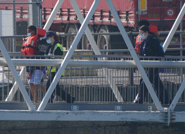 People thought to be migrants are brought ashore in Dover