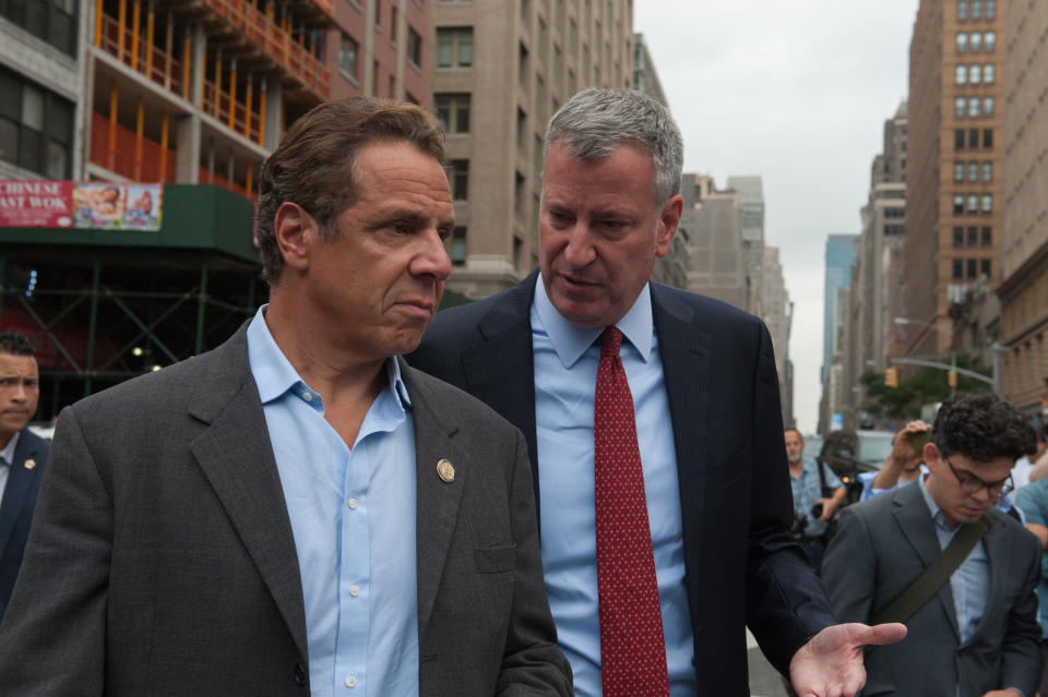 Squabbling at the beginning of the pandemic between Cuomo, left, and New York City Mayor Bill de Blasio, right, resulted in an additional 17,500 deaths in the New York City area, according to one study. (Photo: Photo by Stephanie Keith/Getty Images)