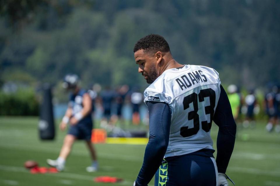 Seattle Seahawks safety Jamal Adams watches the first day of training camp at the Virginia Mason Athletic Center on July 27, 2022. Adams didn’t attend day two as he was getting second opinions on his surgically repaired hand.