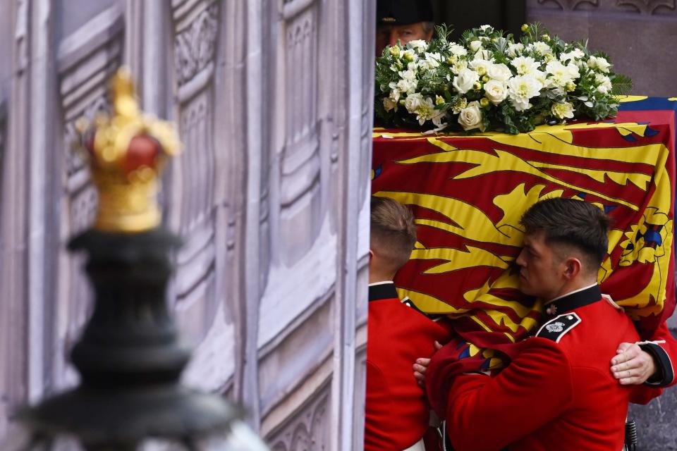 Pallbearers from The Queen's Company, 1st Battalion Grenadier Guards carry the coffin of Queen Elizabeth II into Westminster Hall on September 14, 2022.