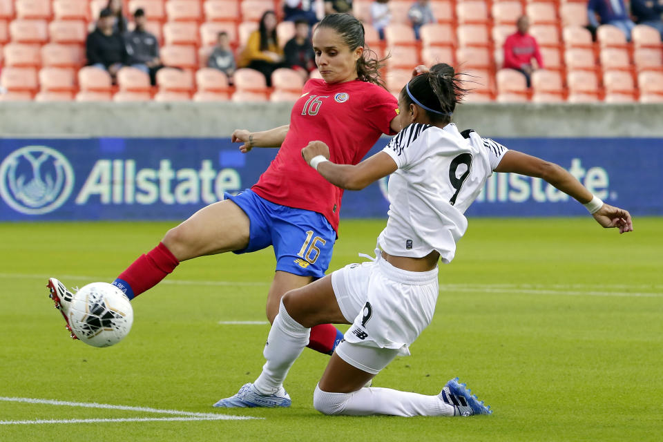 Costa Rica midfielder Katherine Alvarado (16) kicks away the ball as Panama forward Amarelis De Mera (9) slides in for an attempted steal during the first half of a women's Olympic qualifying soccer match Tuesday, Jan. 28, 2020, in Houston. (AP Photo/Michael Wyke)