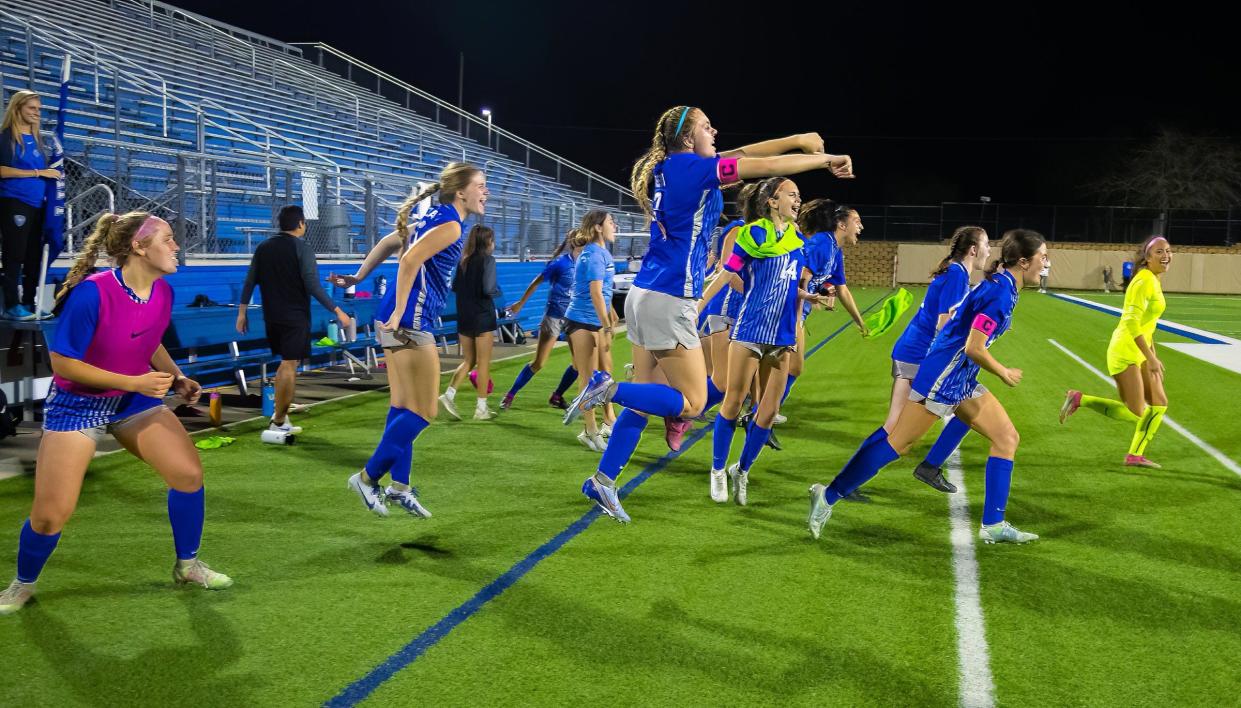 Georgetown players rush off the bench to celebrate Tuesday's 4-0 shutout win over East View, which secured the District 23-5A championship.