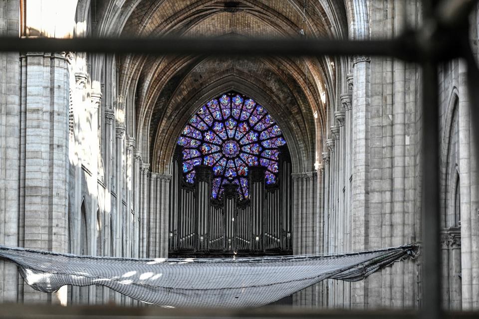 FILE - This July 17, 2019 file photo shows the big organ during preliminary work at the Notre-Dame de Paris, in Paris. Pipe by precious pipe, the organ that once thundered through fire-ravaged Notre Dame Cathedral is being taken apart. The mammoth task of dismantling, cleaning and re-assembling France's largest musical instrument started Monday Aug.3, 2020 and is expected to last nearly four years. (Stephane de Sakutin/Pool via AP, File)