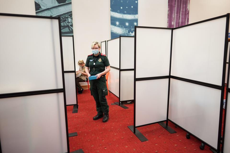 A paramedic waits to administer a Covid-19 vaccination at a mass vaccination hub at the Life Science Centre at the International Centre for Life in Newcastle upon Tyne, northeast England, on January 9, 2021 one of the seven mass vaccination centres, which will open to the public next week as Britain continues with their Covid-19 vaccination programme. - The Centre For Life in Newcastle vaccinated key workers this weekend. It will be one of seven mass vaccination hubs opening around the country. UK health officials and ministers have described the vaccination roll-out as a head-to-head race against the virus and the vaccination programme as the best hope of a return to normality. (Photo by Ian Forsyth / POOL / AFP) (Photo by IAN FORSYTH/POOL/AFP via Getty Images)