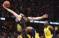 Apr 18, 2018; Cleveland, OH, USA; Cleveland Cavaliers center Kevin Love (0) grabs a loose ball in front of Indiana Pacers guard Victor Oladipo (4) during the second half in game two of the first round of the 2018 NBA Playoffs at Quicken Loans Arena. Mandatory Credit: Ken Blaze-USA TODAY Sports