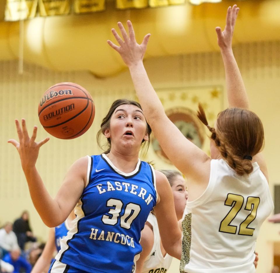 Eastern Hancock forward Ruby White (30) loses control of the ball against Lapel Bulldogs Jocelyn Love (22) on Tuesday, Dec. 12, 2023, during the game at Lapel High School in Lapel. Eastern Hancock defeated the Lapel Bulldogs, 62-55.