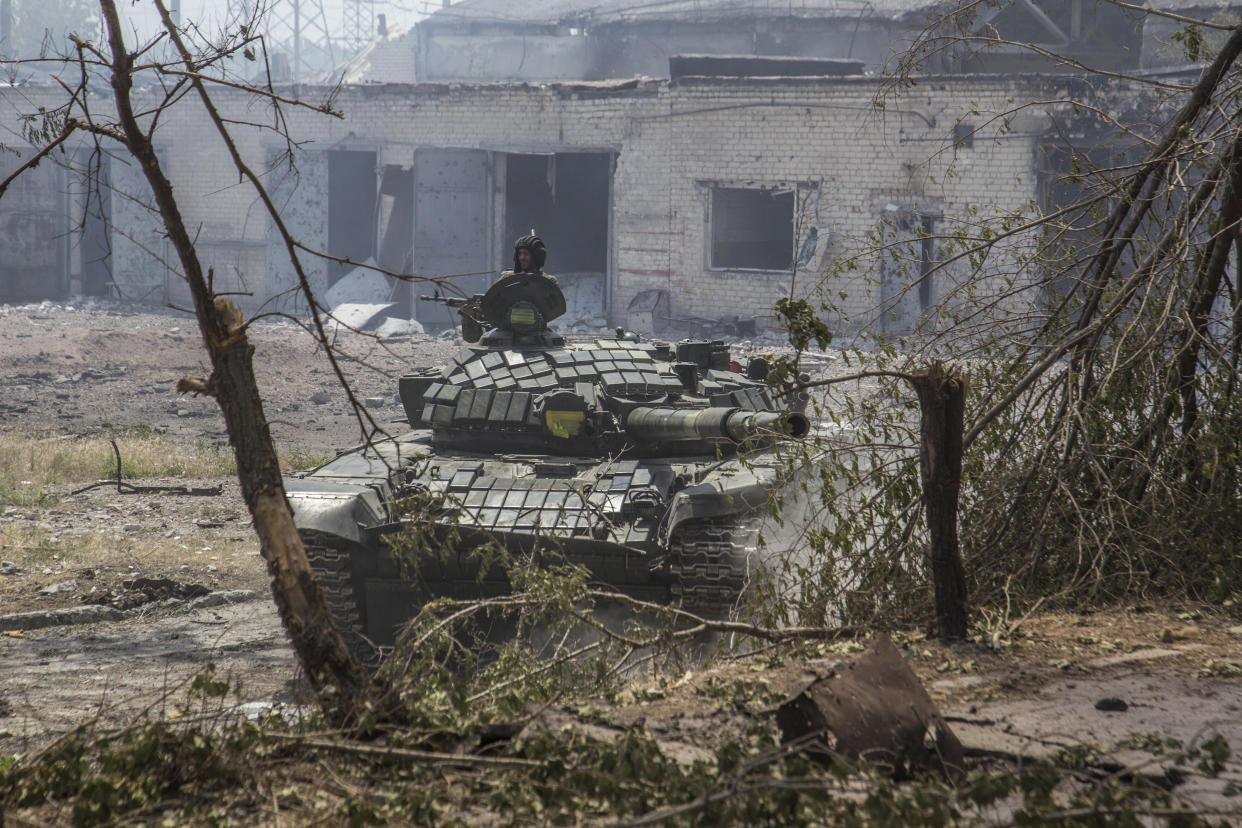 A Ukrainian tank is in position during heavy fighting on the front line in Severodonetsk, the Luhansk region, Ukraine, Wednesday, June 8, 2022. (AP Photo/Oleksandr Ratushniak)