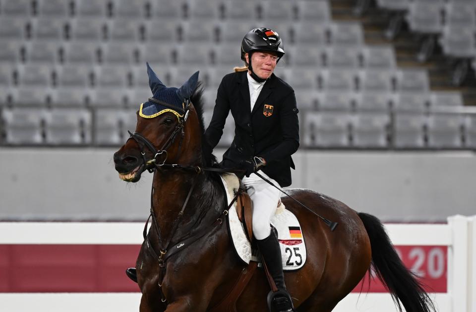 Annika Schleu of Germany reacts in the riding portion of the women's individual of modern pentathlon at Tokyo 2020 Olympic Games, in Tokyo, Japan, Aug. 6, 2021. (Photo by Dai Tianfang/Xinhua via Getty Images)