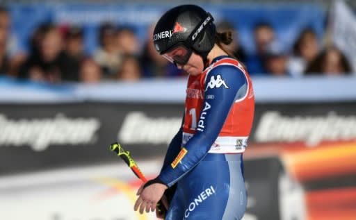 Italy's Sofia Goggia nurses her left arm which she fractured after a crash in the women's super-G World Cup race in Garmisch-Partenkirchen on Sunday