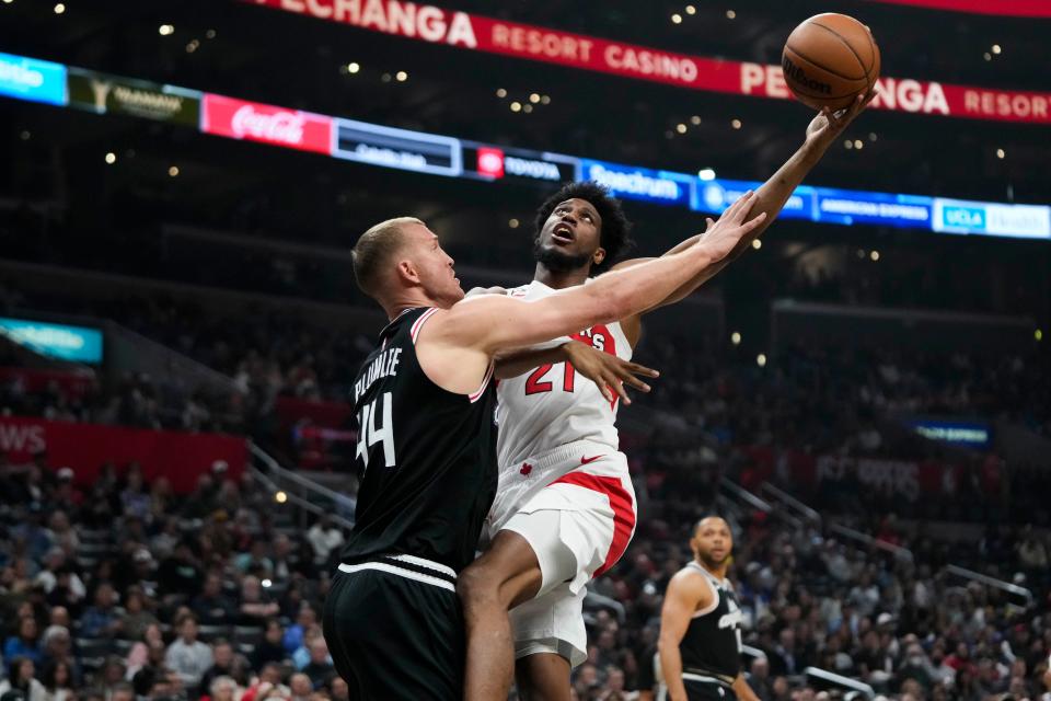 Toronto Raptors' Thaddeus Young (21) puts up a shot against Los Angeles Clippers' Mason Plumlee (44) during first half of an NBA basketball game Wednesday, March 8, 2023, in Los Angeles. (AP Photo/Jae C. Hong)
