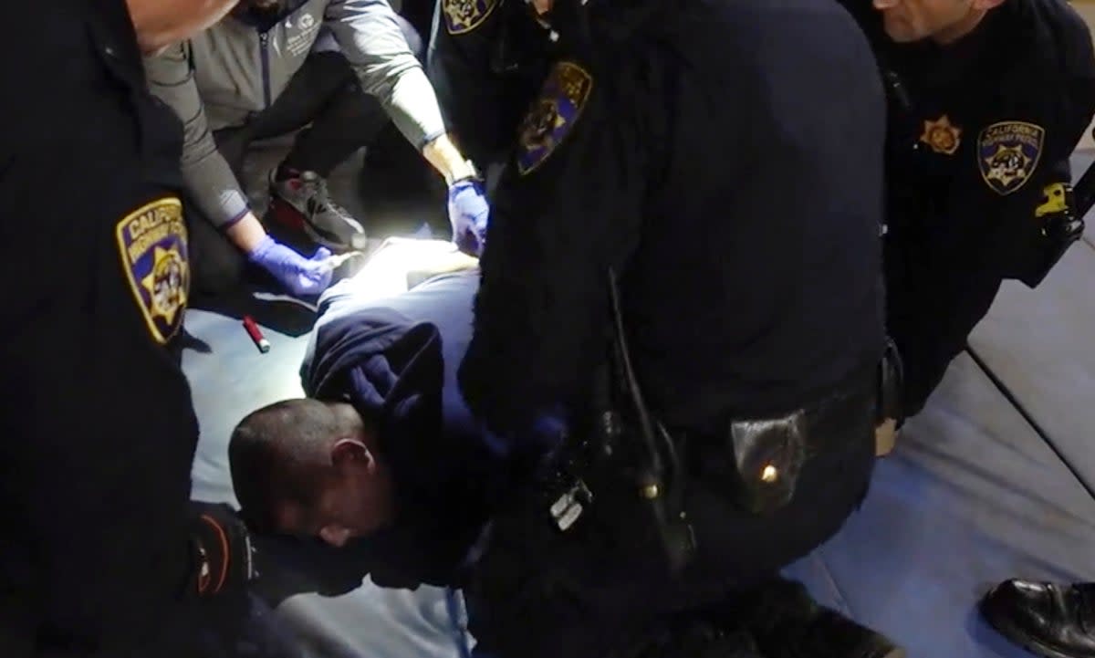 In this image taken from a nearly 18-minute video taken by a California Highway Patrol sergeant, Edward Bronstein, 38, is taken into custody by CHP officers on March 31, 2020, following a traffic stop (AP)