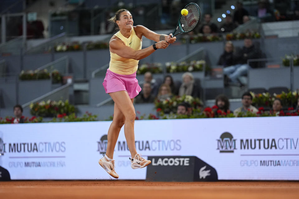 Aryna Sabalenka of Belarus returns the ball to Elena Rybakina of Kazakhstan during the Mutua Madrid Open tennis tournament in Madrid, Spain, Thursday, May 2, 2024. (AP Photo/Manu Fernandez)