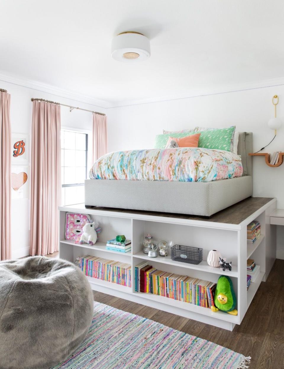 a bedroom with a bed and books