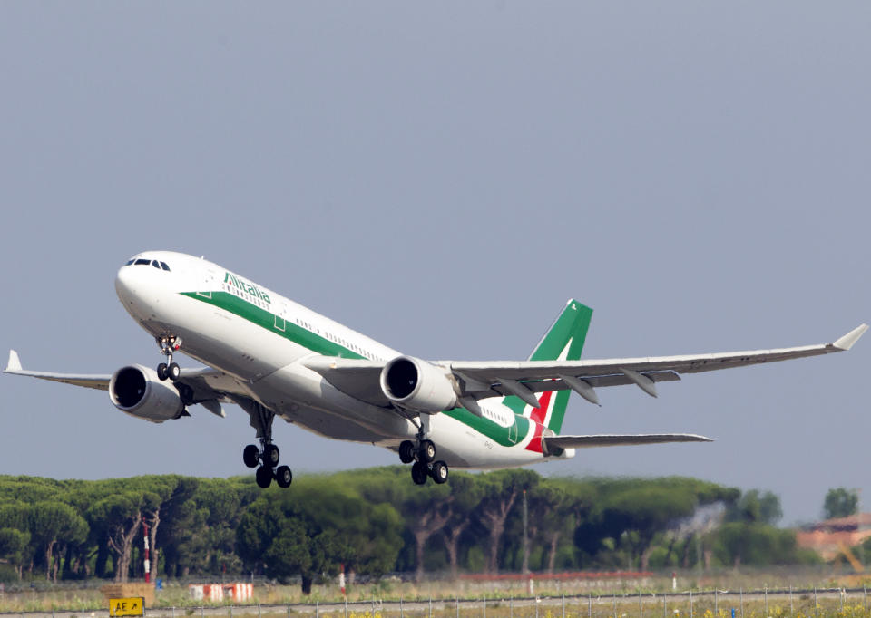 FILE - In this Sunday, July 5, 2015 file photo, an Alitalia plane takes off from Rome's Leonardo Da Vinci international airport. The Italian government is hoping the Alitalia airline will turn a new page after four private investors expressed an interest in joining the state railway, the Italian treasury and Delta Air Lines in trying once again to relaunch the struggling flagship carrier. (AP Photo/Riccardo De Luca, File)