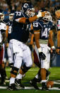 Lyle McCombs #43 of the Univeristy of Connecticut Huskies is congratulated by teammate Alex Mateas #73 after scoring a touchdown in the first quarter against the University of Massachusetts Minutemen during the game on August 30, 2012 at Rentschler Field in East Hartford, Connecticut. (Photo by Jared Wickerham/Getty Images)