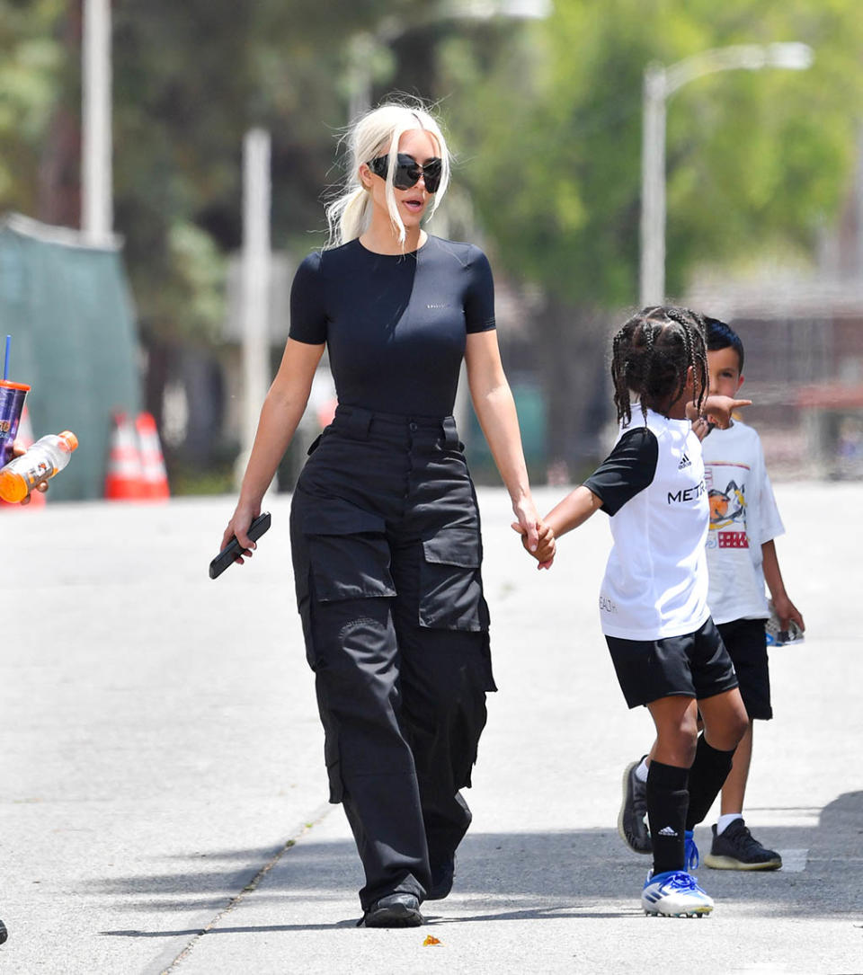 Kim Kardashian and her son Saint West at his soccer game in Los Angeles on May 15, 2022. - Credit: SplashNews.com