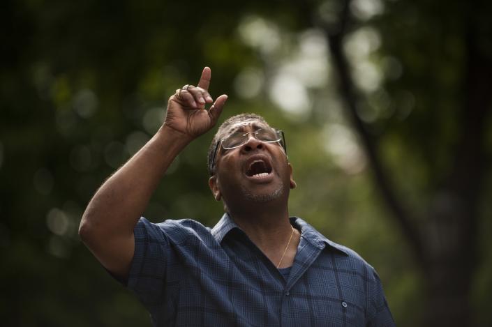 <p>Pastor Brian Heron leads a prayer for Philando Castile outside Governor’s Mansion on July 7, 2016 in St. Paul, Minn. (Stephen Maturen/Getty Images) </p>