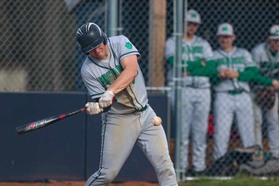 Mogadore catcher Mason Williams connects for a hit during Thursday night's game at Rootstown High School.