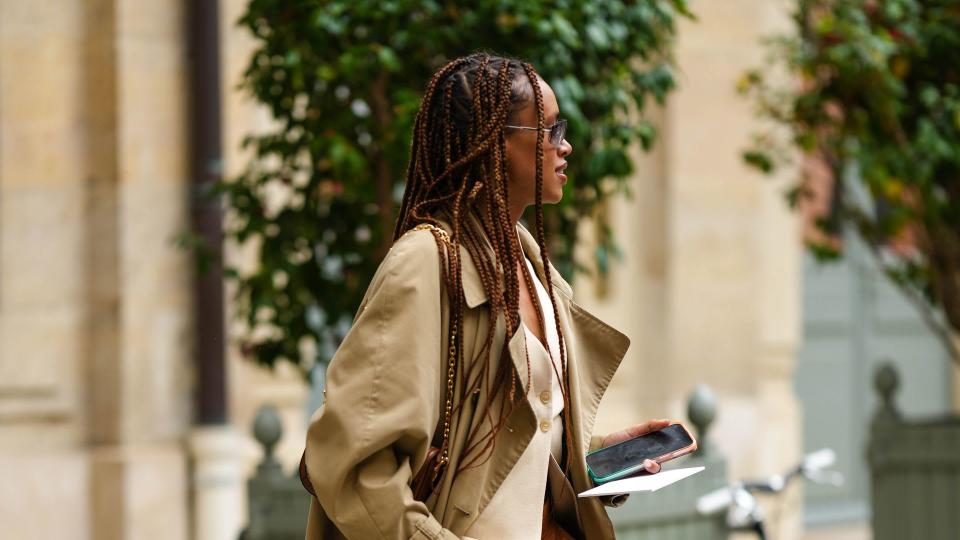 Woman wearing a trench coat with waistcoat 