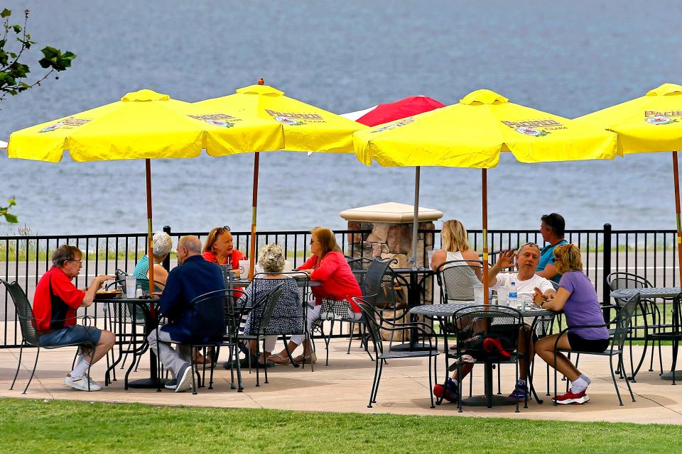 Dinners eat lunch on a patio at Lake Hefner  in Oklahoma City, Wednesday, May 27, 2020. [Bryan Terry/The Oklahoman]