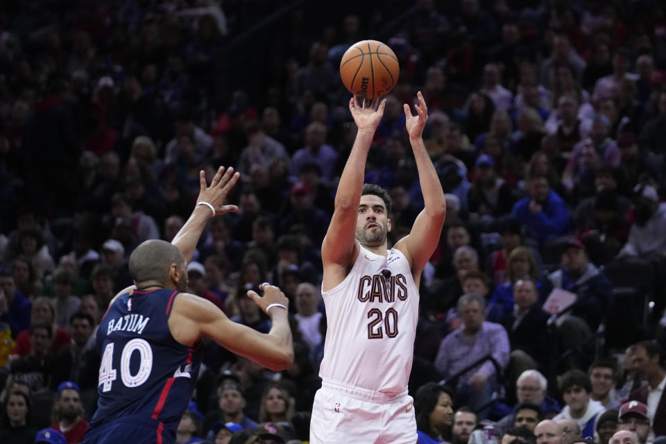 Cleveland Cavaliers' Georges Niang, right, goes up for a shot against Philadelphia 76ers' Nicolas Batum during the first half of an NBA basketball in-season tournament game, Tuesday, Nov. 21, 2023, in Philadelphia. (AP Photo/Matt Slocum)