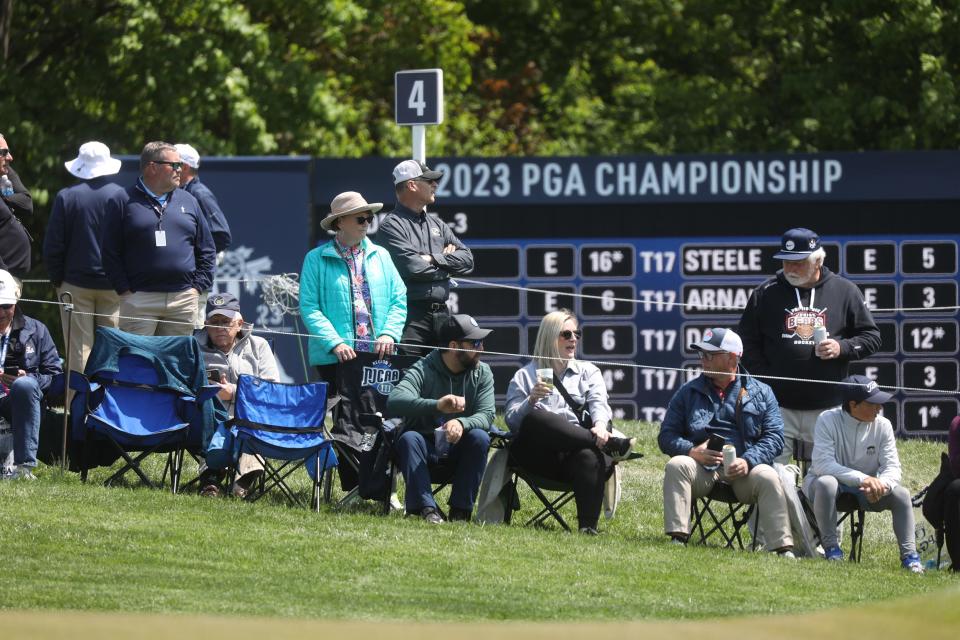 Some fans picked their spot along the fairway, set up their chairs and watched as golfers played through.