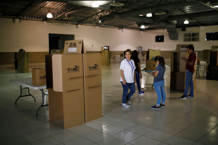 Electoral worker checks a polling station at the International Fairs and Convention Center in San Salvador, El Salvador, February 2, 2019. REUTERS/Jose Cabezas