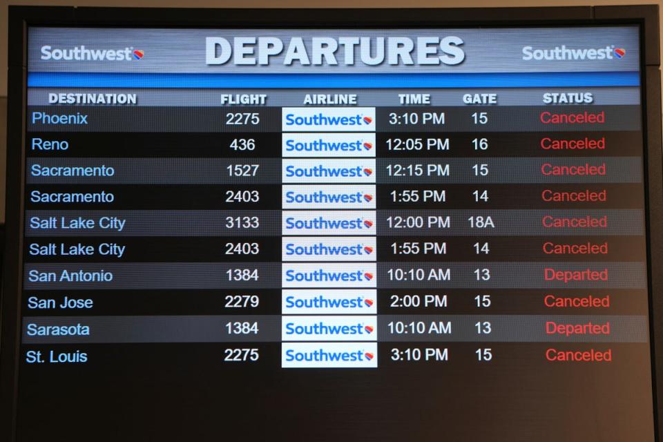 An airport monitor shows a string of Southwest cancellations over the holidays (Copyright 2022 The Associated Press. All rights reserved)