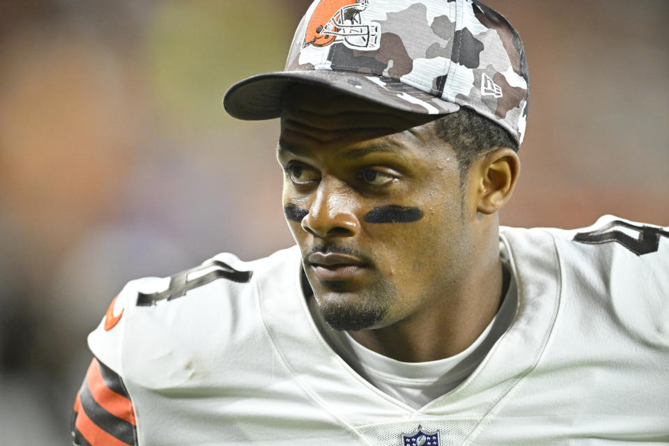 Cleveland Browns quarterback Deshaun Watson walks on the field during an NFL preseason football game against the Chicago Bears, Saturday, Aug. 27, 2022, in Cleveland. The Bears won 21-20. (AP Photo/David Richard)