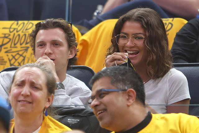 Jim Poorten/NBAE via Getty Images Tom Holland and Zendaya