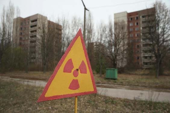 A sign warns of radiation contamination near former apartment buildings in Pripyat in 2016 (Sean Gallup/Getty Images)