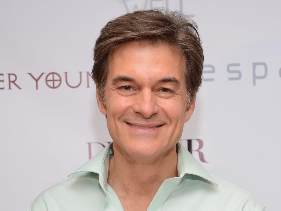 Dr. Mehmet Oz smiles at an event